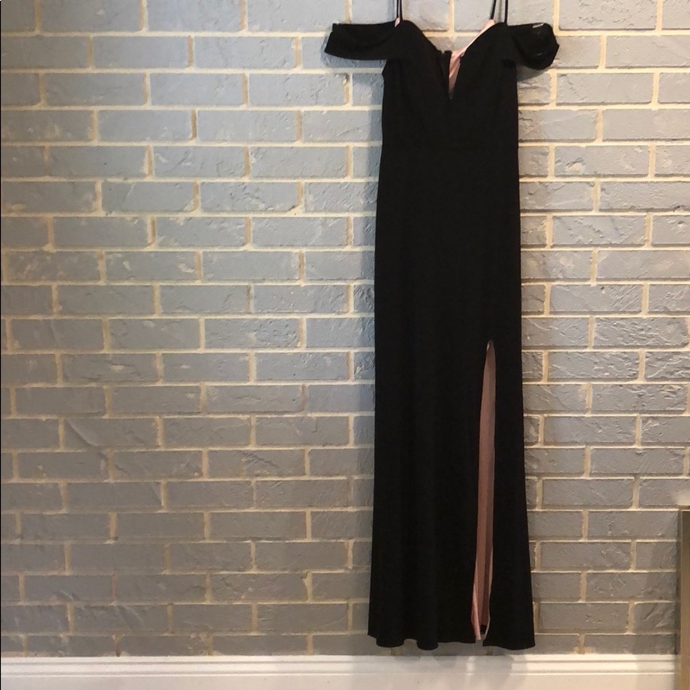 Formal black dress with pink lining.